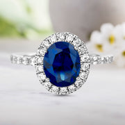 Simulated Gemstone and Cubic Zirconia Halo Ring in Rhodium Plated Sterling Silver