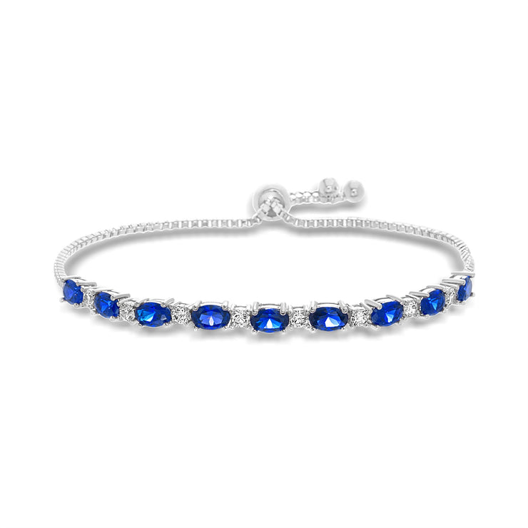 Oval Prong Set Simulated Blue Sapphire and Round Cubic Zirconia  Adjustable Bridal Tennis Bracelet for Women in Rhodium Plated 925 Sterling Silver
