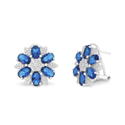 Cubic Zirconia or Simulated Blue Sapphire Flower Shaped Stud Earring with Omega Back in Rhodium Plated Silver
