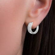 Cubic Zirconia Bezel Cross Design Huggie Earrings in Sterling Silver